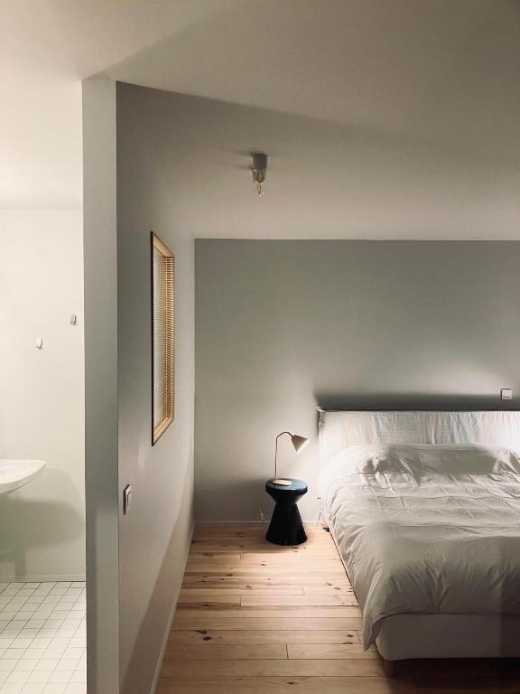Postel nebo postele na pokoji v ubytování Maison Henri Namur
