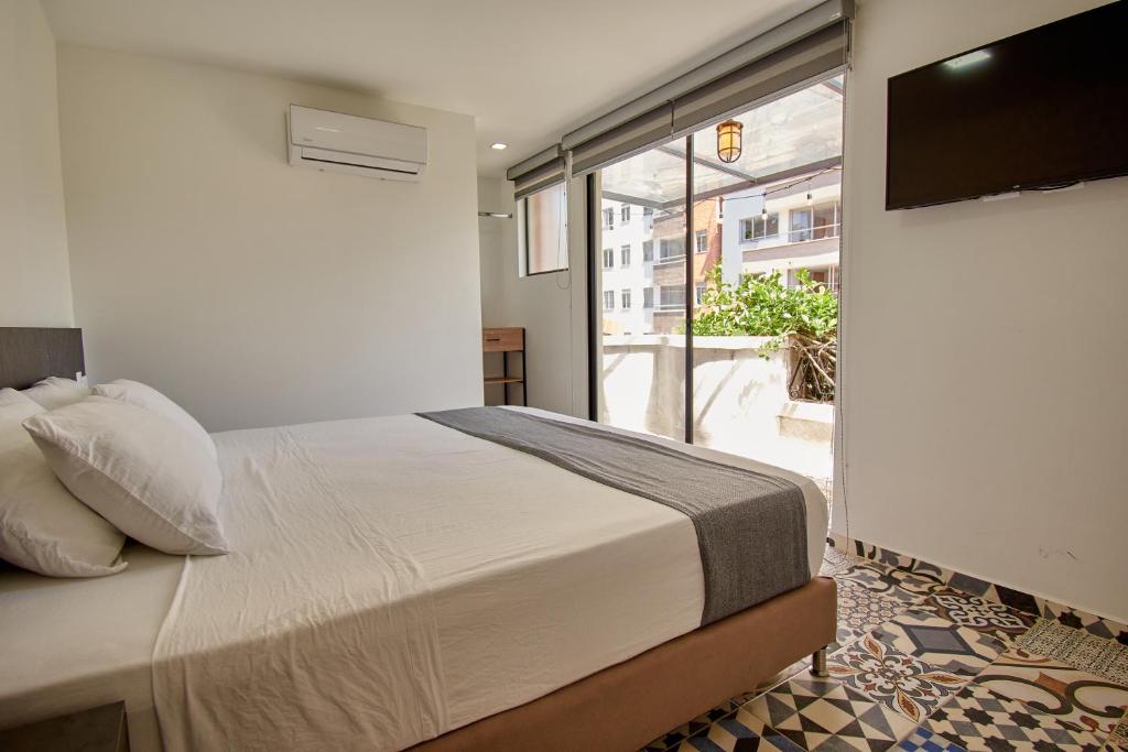 Postel nebo postele na pokoji v ubytování Brana by Bernalo Hotels
