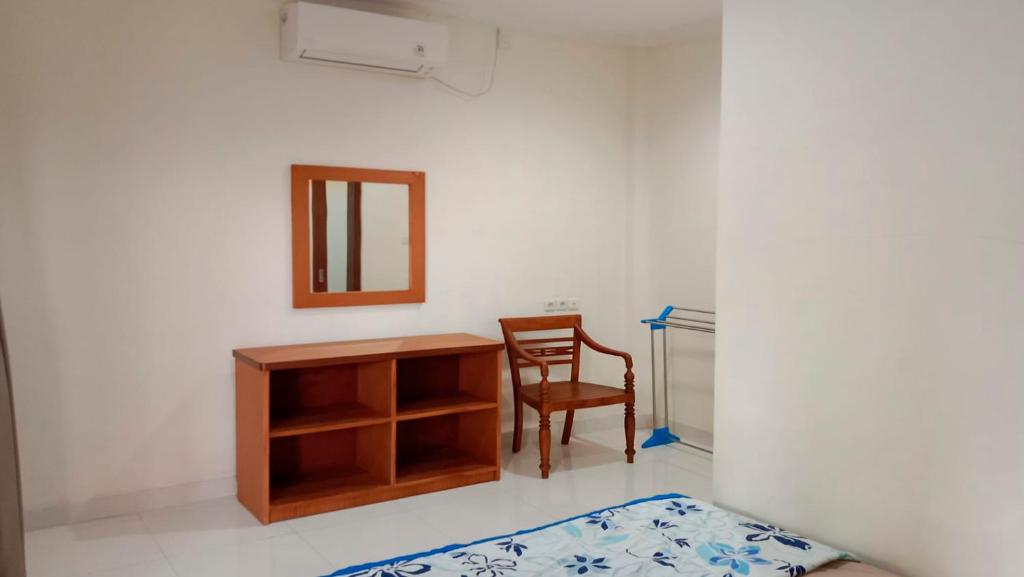 Postel nebo postele na pokoji v ubytování Nova Homestay Ubud