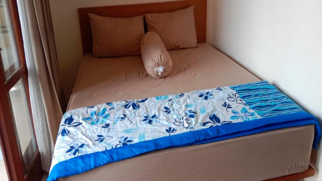 Postel nebo postele na pokoji v ubytování Nova Homestay Ubud