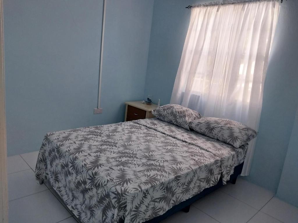 Postel nebo postele na pokoji v ubytování Avocado Suites
