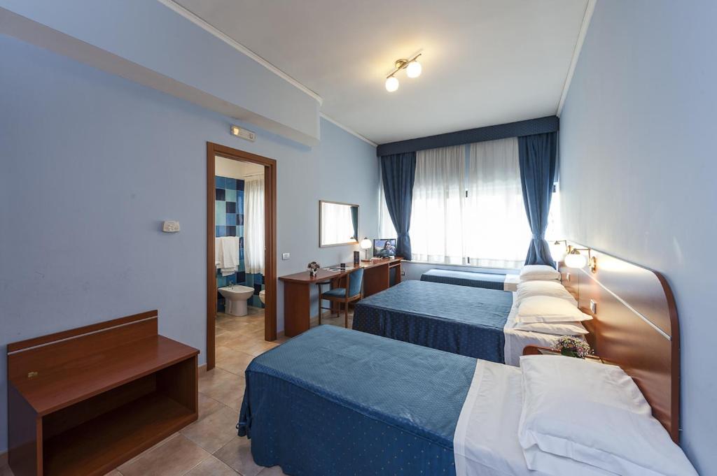 Postel nebo postele na pokoji v ubytování Millennium Gold Hotel