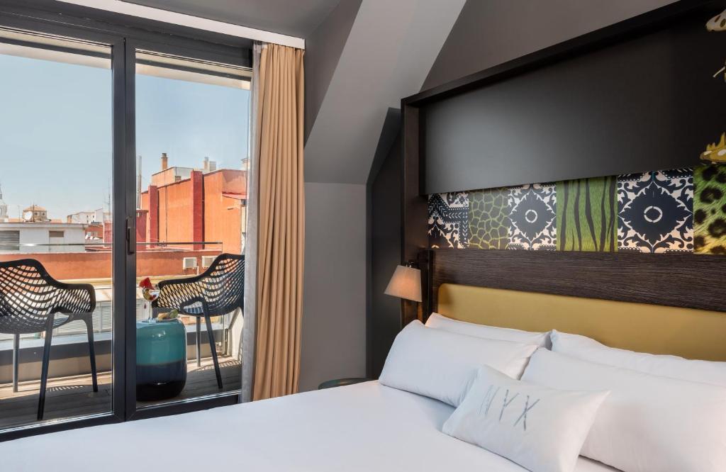 Postel nebo postele na pokoji v ubytování NYX Hotel Madrid by Leonardo Hotels