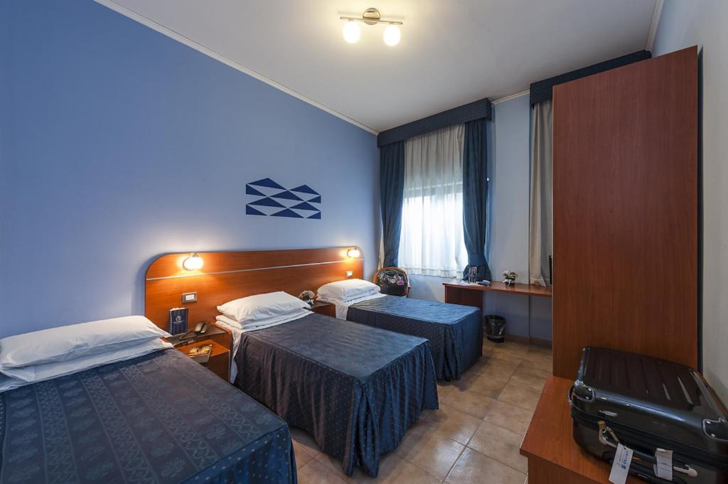 Postel nebo postele na pokoji v ubytování Millennium Gold Hotel