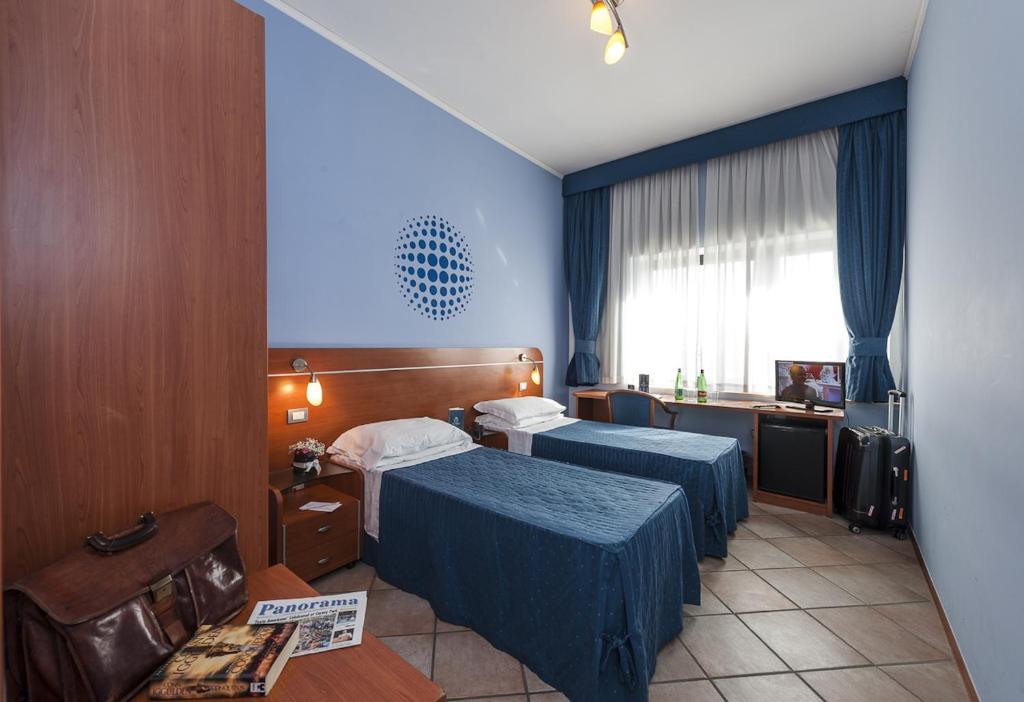 Postel nebo postele na pokoji v ubytování Millennium Gold Hotel