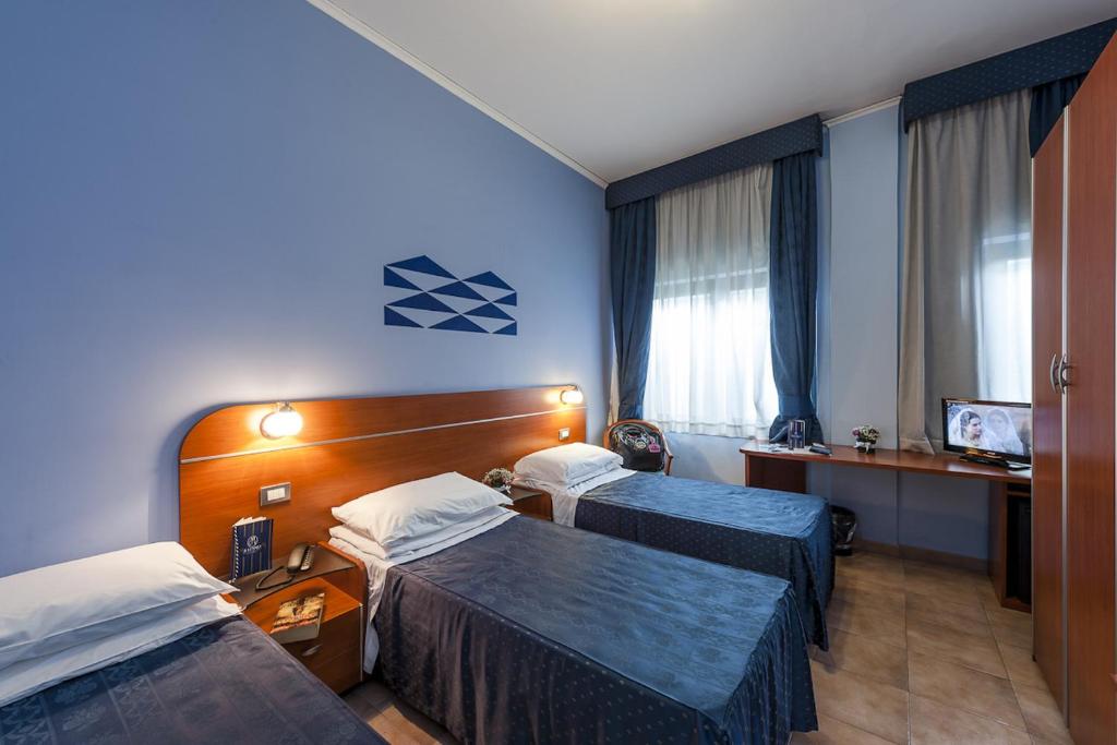 Postel nebo postele na pokoji v ubytování Millennium Gold Hotel