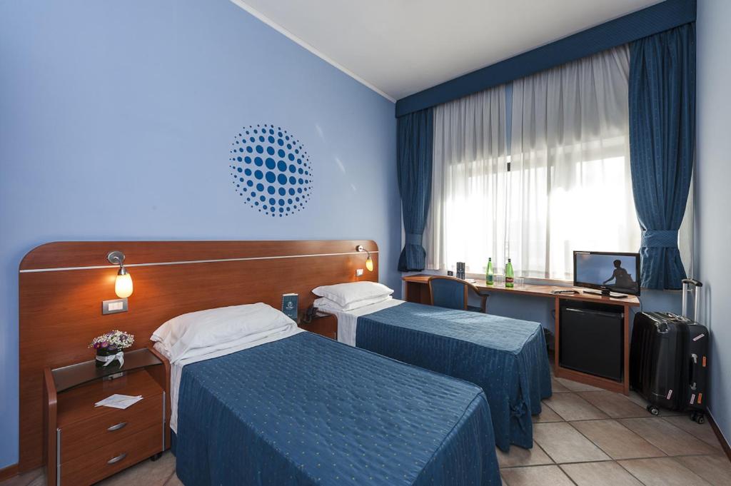 Postel nebo postele na pokoji v ubytování Millennium Gold Hotel