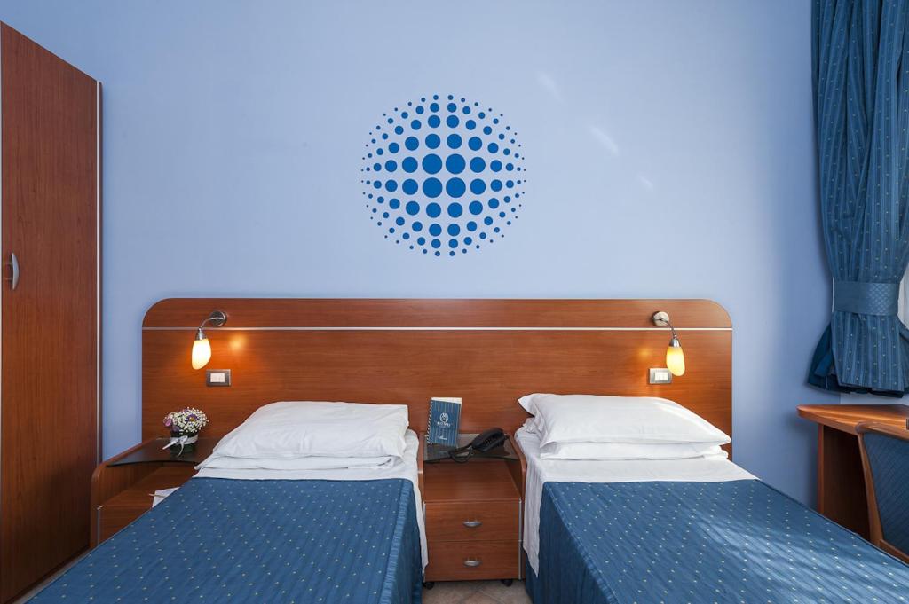 Postel nebo postele na pokoji v ubytování Millennium Gold Hotel