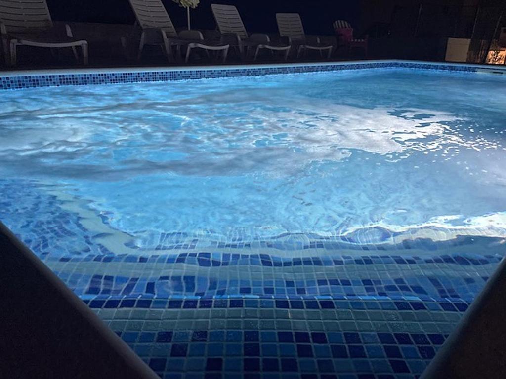 Bazén v ubytování Family friendly apartments with a swimming pool Seget Vranjica, Trogir - 12476 nebo v jeho okolí