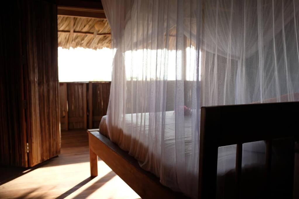Postel nebo postele na pokoji v ubytování Rumah Tinggi at Pachamama