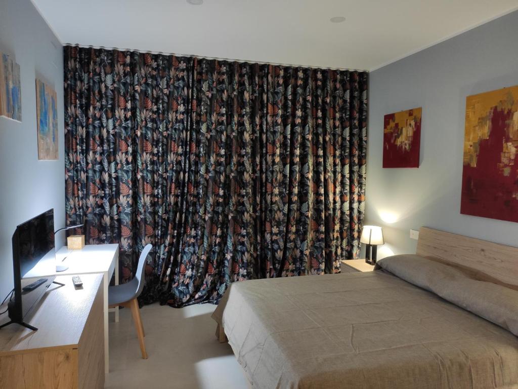 Postel nebo postele na pokoji v ubytování GArt Riviera B&B