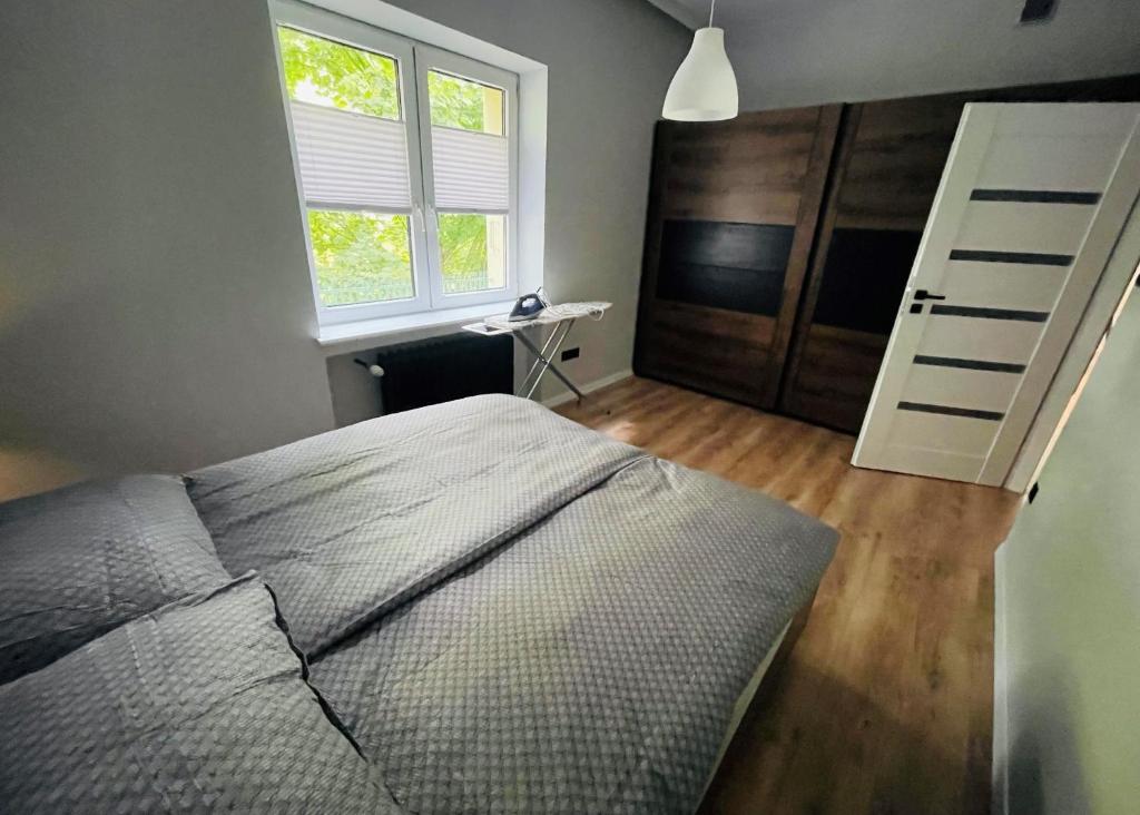 Posteľ alebo postele v izbe v ubytovaní Apartament Majka