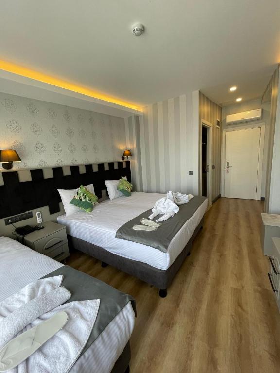 Postel nebo postele na pokoji v ubytování Old City Viva Hotel