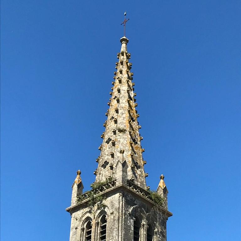 a church steeple with a cross on top of it at Chambres d&#39;Hôtes Bienvenue in LʼAbsie