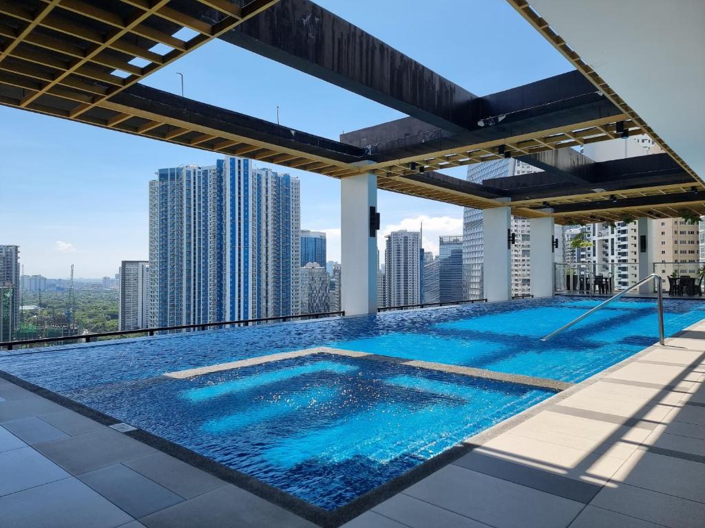 a swimming pool on the roof of a building at The Residences at BCCT in Manila