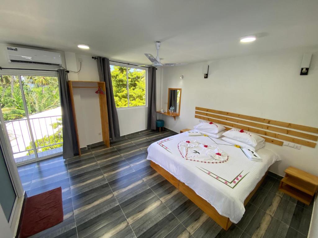Postel nebo postele na pokoji v ubytování Ramzu Villa Thoddoo