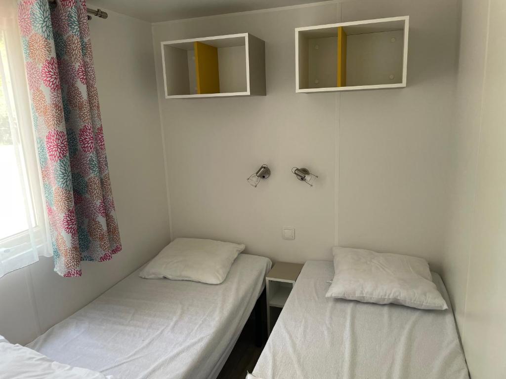 Postel nebo postele na pokoji v ubytování Le Vrai Paradis