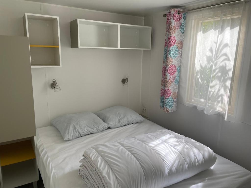 Postel nebo postele na pokoji v ubytování Le Vrai Paradis
