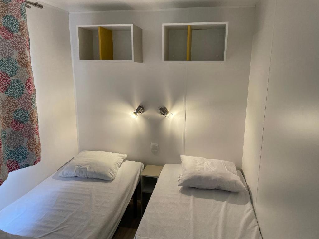 Postel nebo postele na pokoji v ubytování Le Vrai Paradis