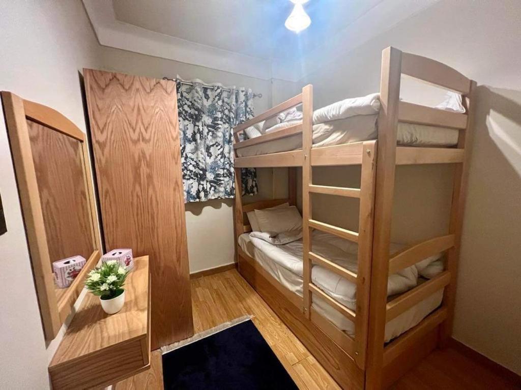 a small room with two bunk beds in it at Alexander House in Alexandria