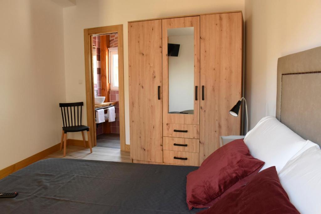 Postel nebo postele na pokoji v ubytování Apartamentos Tierra y Arte