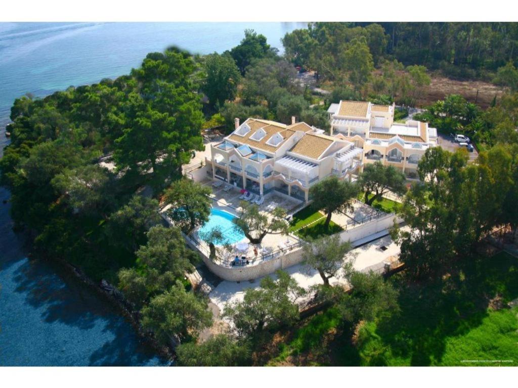 an aerial view of a large house on an island in the water at St Nicholas B8 Beach Studio I in Dafnila