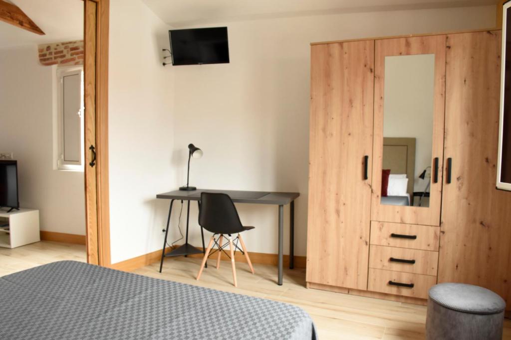 TV a/nebo společenská místnost v ubytování Apartamentos Tierra y Arte