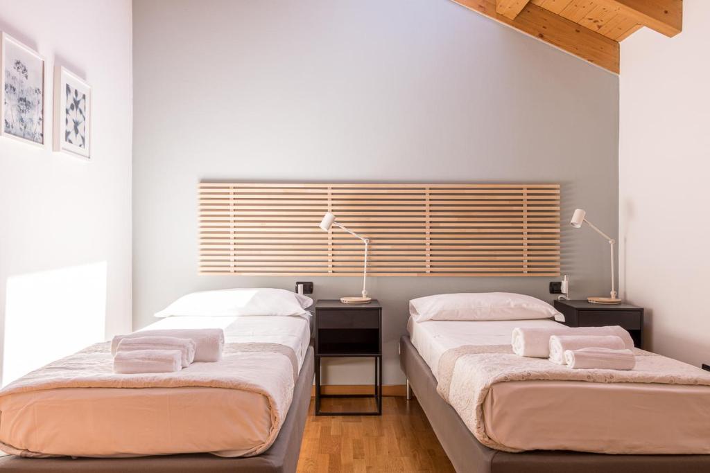 Posteľ alebo postele v izbe v ubytovaní Apartment Tamara Suite - Menaggio