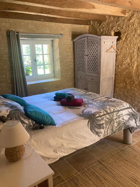 Łóżko lub łóżka w pokoju w obiekcie Logis des 4 fées et son bain nordique