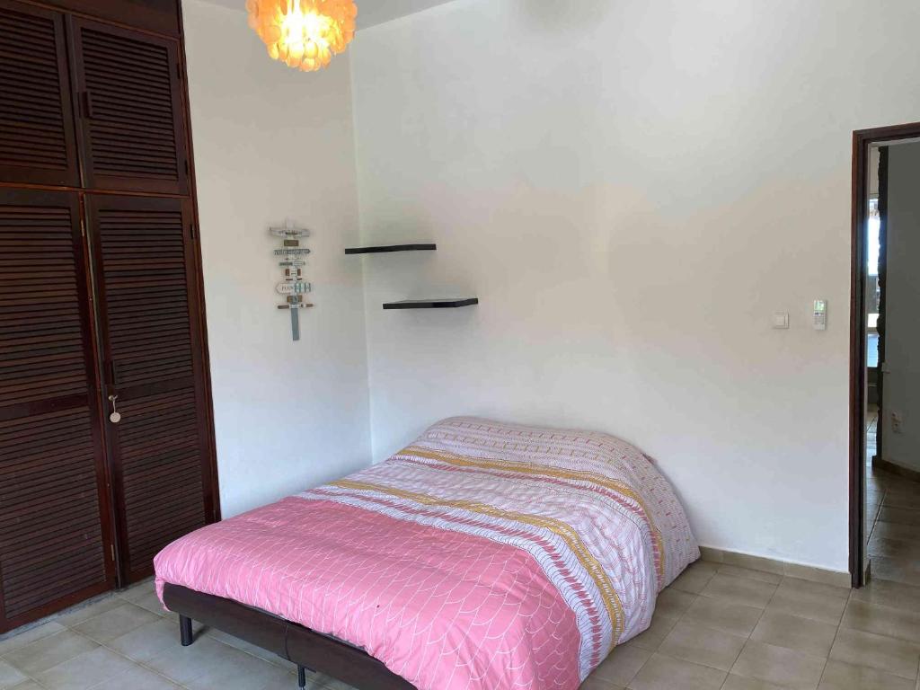 Postel nebo postele na pokoji v ubytování Villa Coco des sables accès direct au lagon