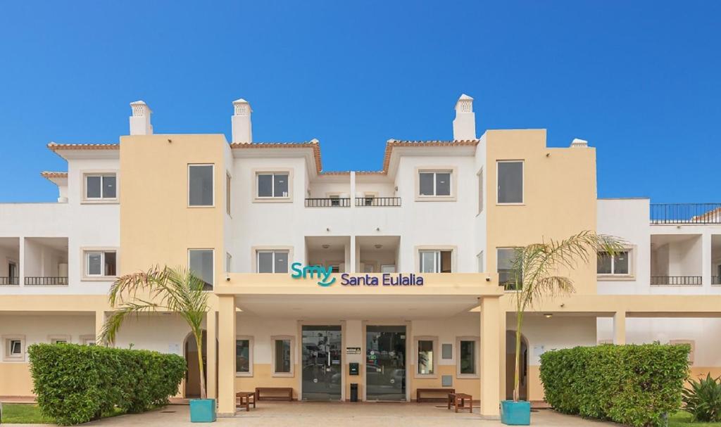 a large white building with a sign on it at Smy Santa Eulalia Algarve in Albufeira