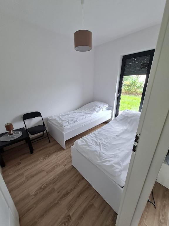 Posteľ alebo postele v izbe v ubytovaní Apartamenty Josef
