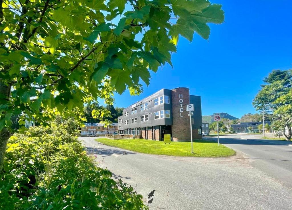 a building on the side of a road at Marina Hotel Lofoten in Svolvær