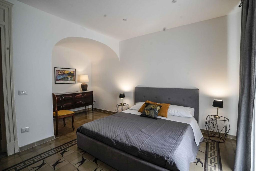 Appartamento Catania centro tesisinde bir odada yatak veya yataklar