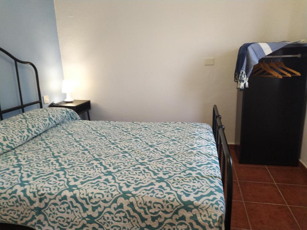 A bed or beds in a room at Garoé Acogedor Apartamento