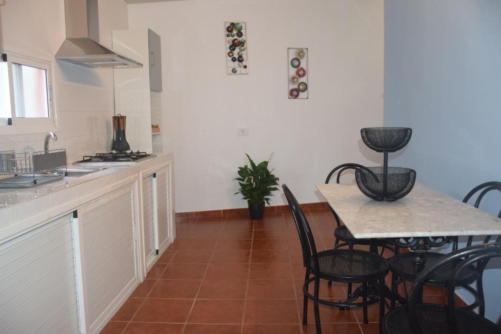 A kitchen or kitchenette at Garoé Acogedor Apartamento