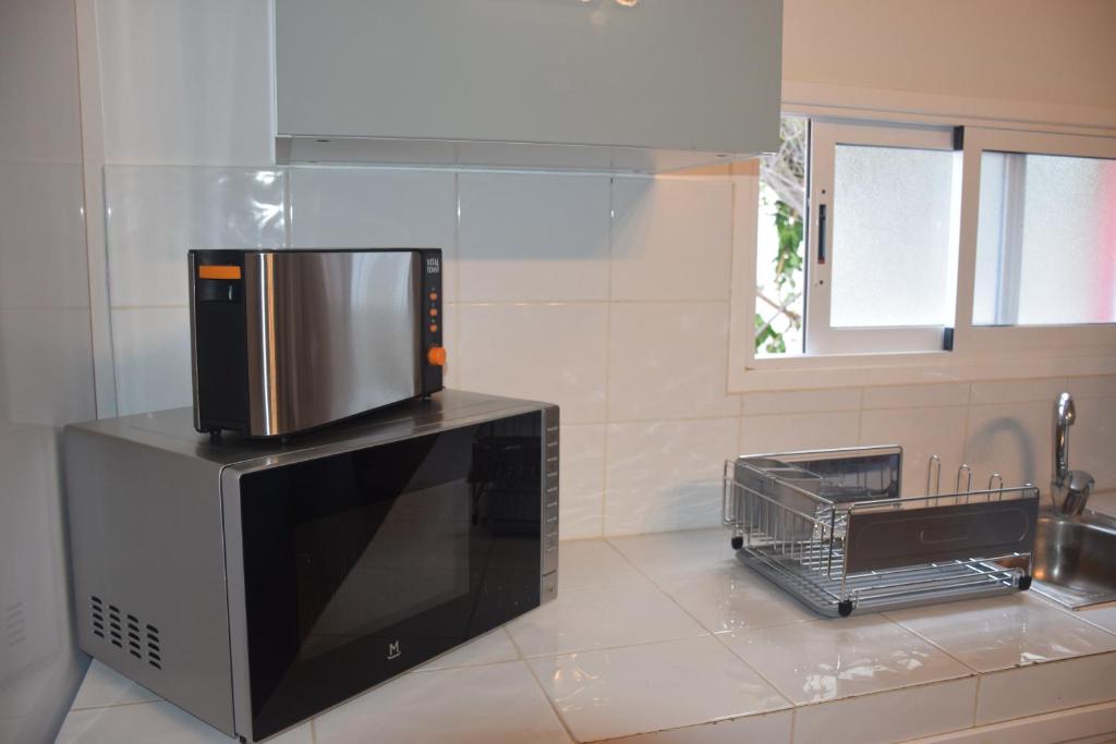 A kitchen or kitchenette at Garoé Acogedor Apartamento