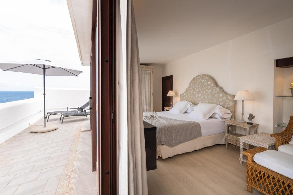 Postel nebo postele na pokoji v ubytování Isla Baja Suites