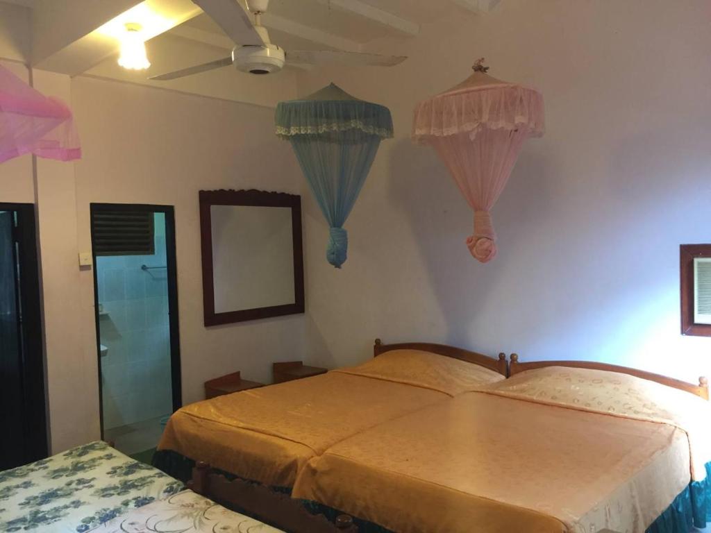 Postel nebo postele na pokoji v ubytování Hotel Shalini