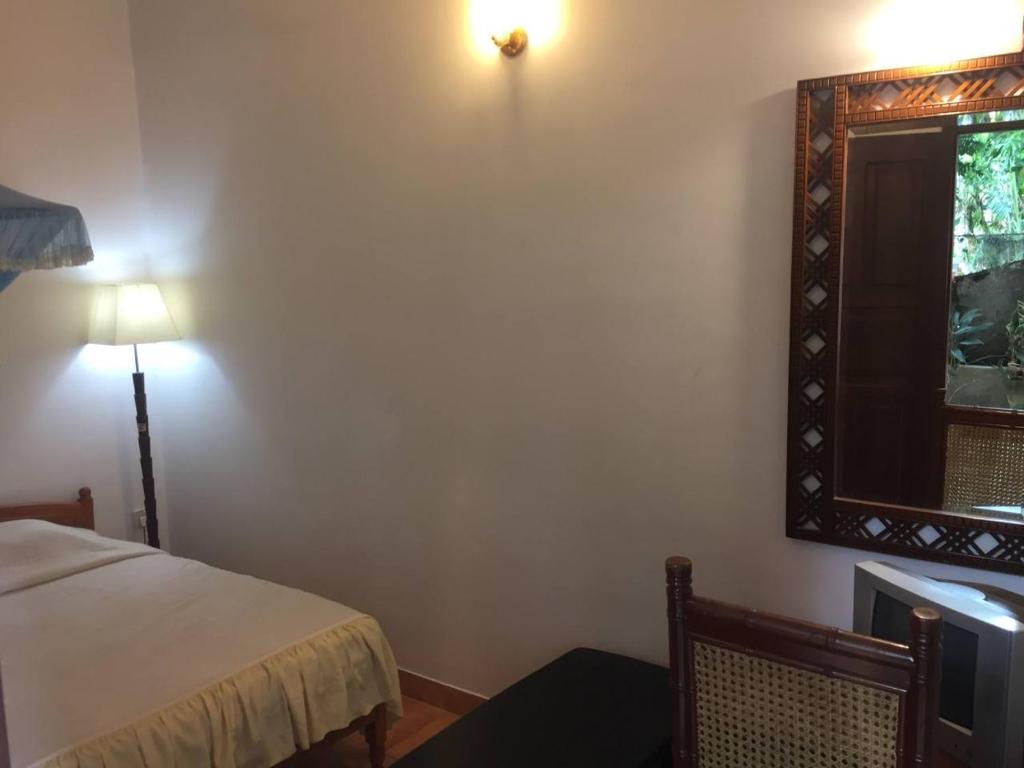 Postel nebo postele na pokoji v ubytování Hotel Shalini