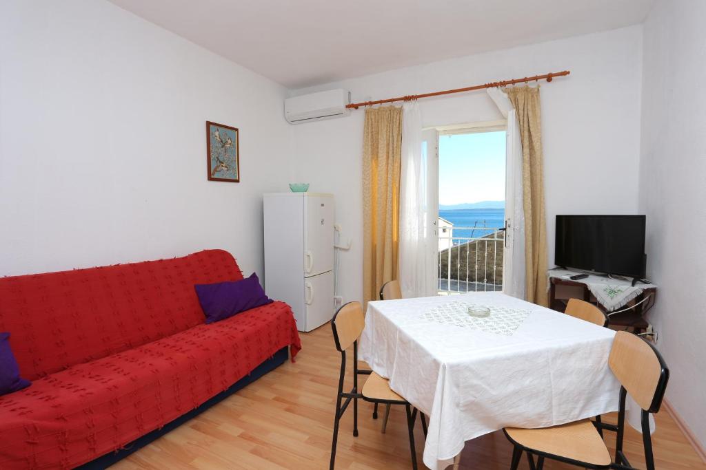 Televízia a/alebo spoločenská miestnosť v ubytovaní Apartment Igrane 311b