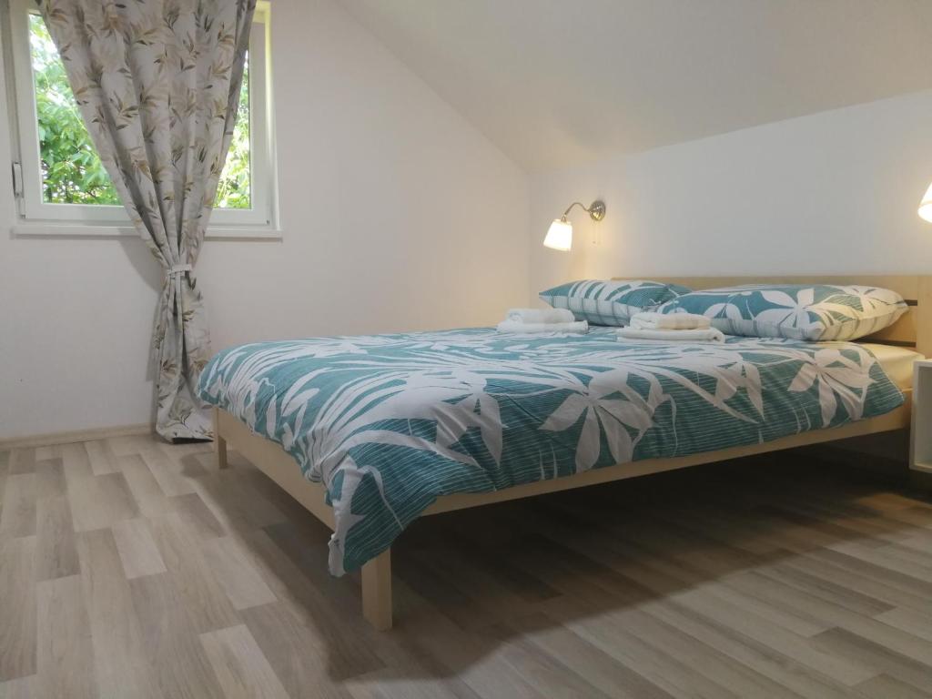 Postel nebo postele na pokoji v ubytování Apartment Smoljanac 12345b