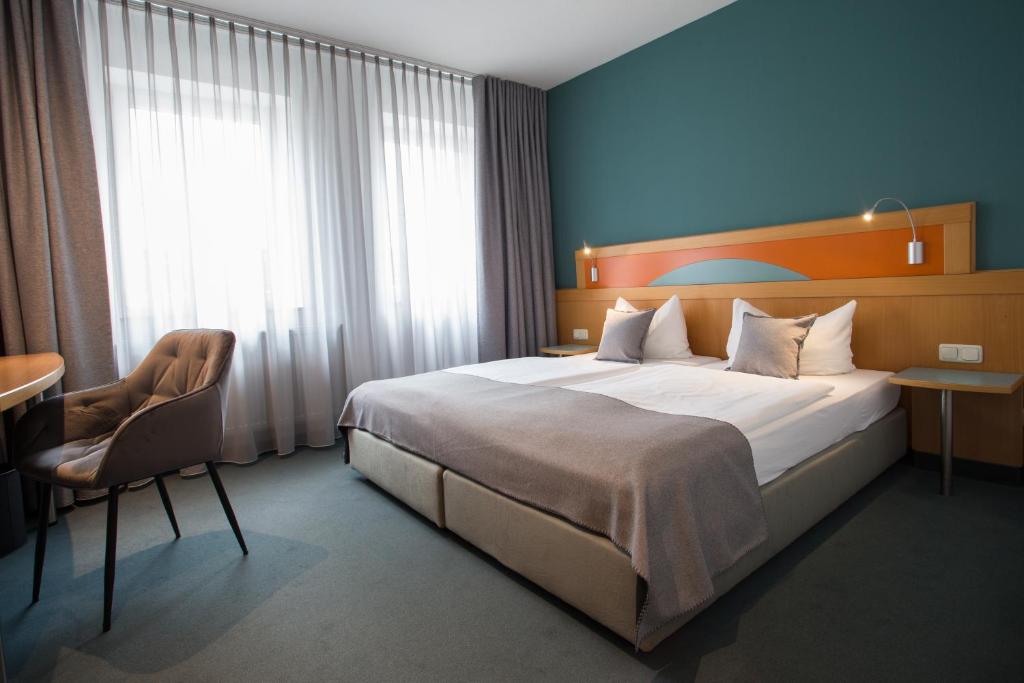 Postel nebo postele na pokoji v ubytování Hotel Gewürzmühle