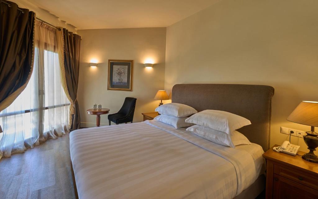 Postel nebo postele na pokoji v ubytování Xenia Palace Portaria