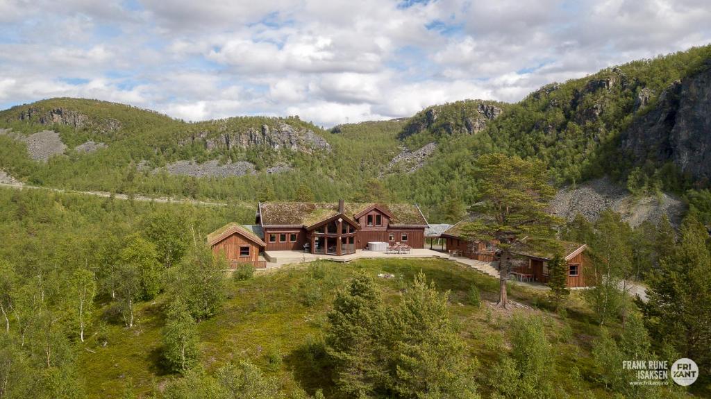 an aerial view of a house in the mountains at Alten Lodge in Alta