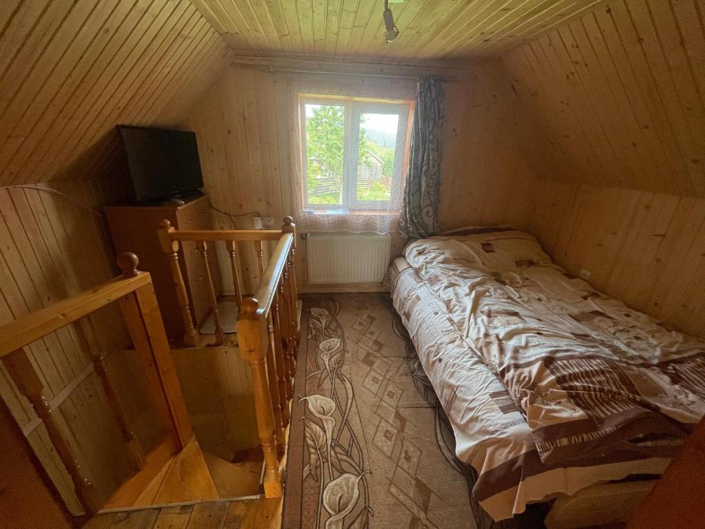 Postel nebo postele na pokoji v ubytování Mini Cottage