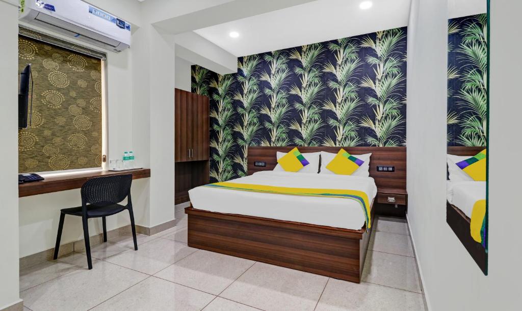 Postel nebo postele na pokoji v ubytování Hotel NRM Residency