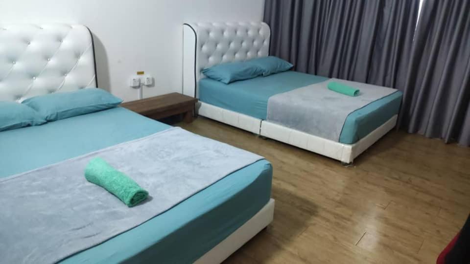 Postel nebo postele na pokoji v ubytování UMMI GUESTROOM