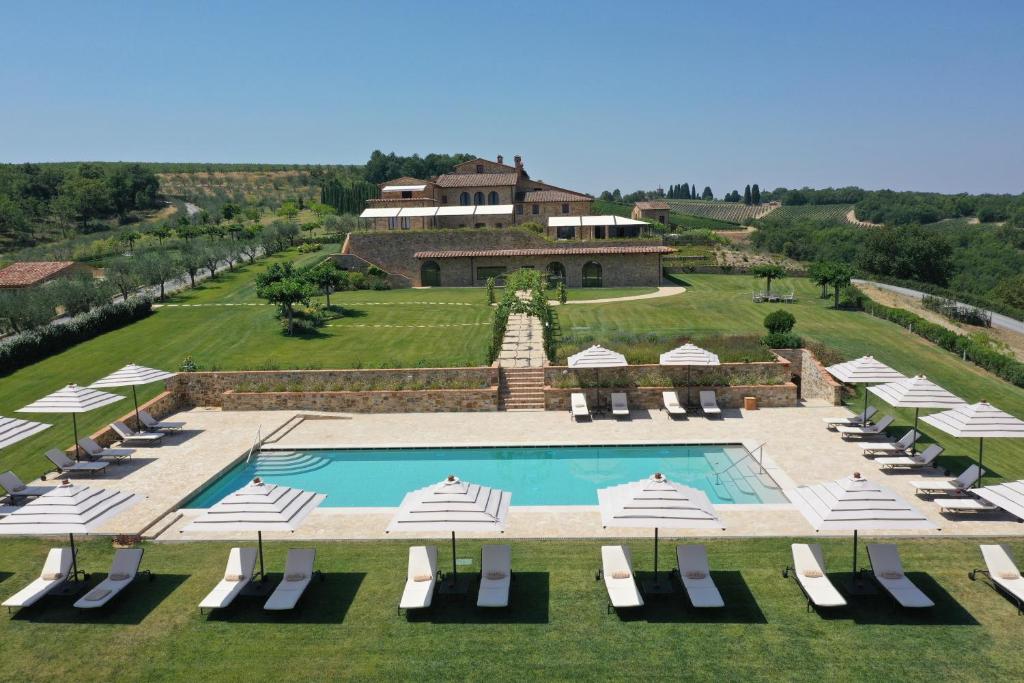 an aerial view of a resort with a swimming pool at The Club House in Castelnuovo Berardenga