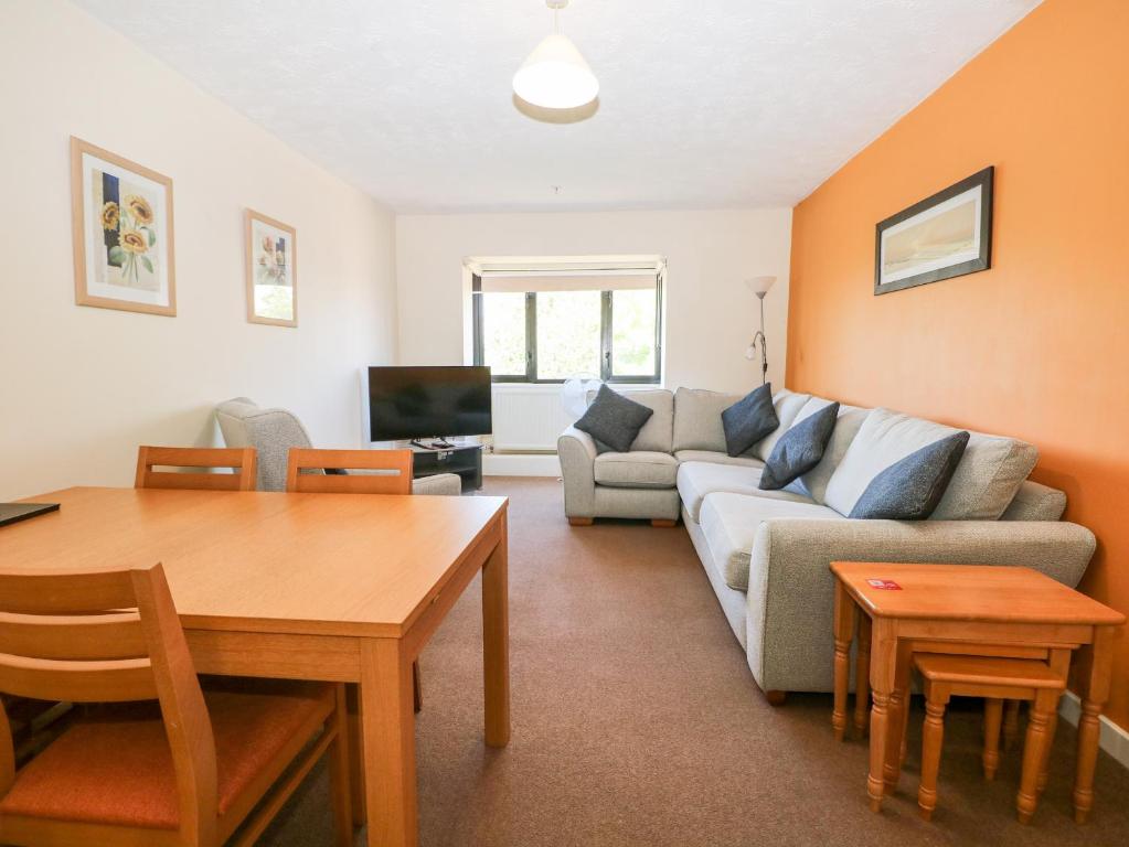 a living room with a couch and a table at Flat 33 - Marine Court in Littlehampton
